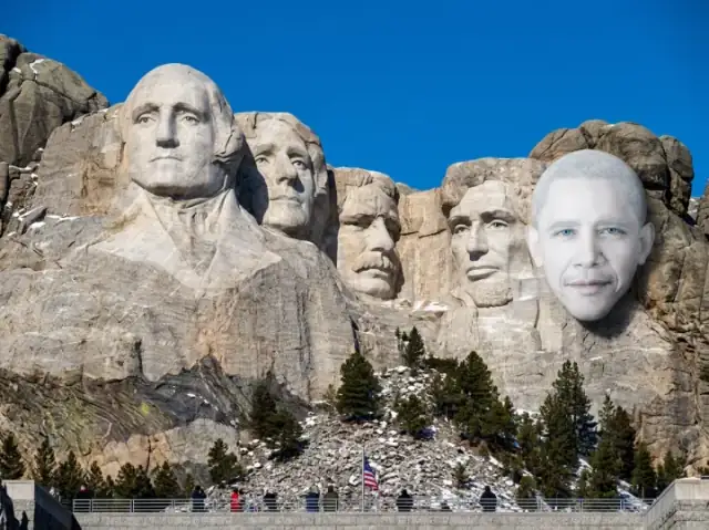 Four stone heads. One of them moved.
